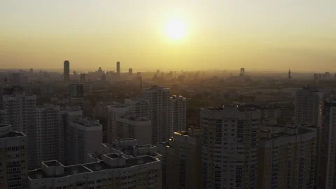 Aerial view of the bright orange sunset over the city. Video stock 134520290