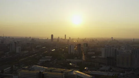 Aerial view of the bright orange sunset over the city. Video stock 134879115