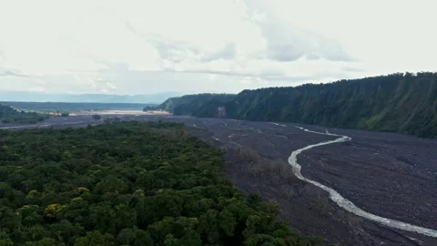 Aerial view of a broad river called Upano in Ecuador Stock Footage 234942239