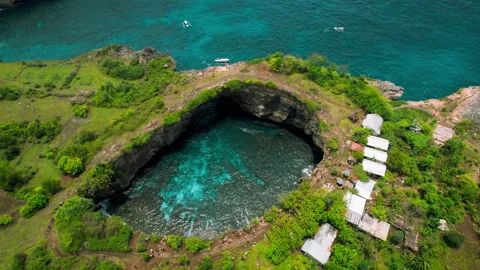 Aerial view of Broken beach in Bali. Tropical high cliffs with crystal clear sea Stock Footage 240771213
