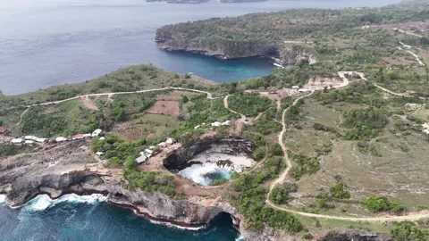 Aerial view of Broken Beach on sunny day. Nusa Penida, Indonesia. Stock Footage 320107135