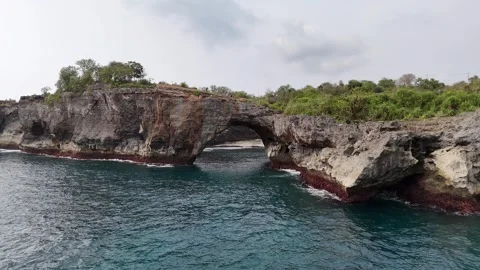 Aerial view of Broken Beach on sunny day. Nusa Penida, Indonesia. Stock Footage 320209613