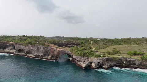 Aerial view of Broken Beach on sunny day. Nusa Penida, Indonesia. Stock Footage 320209631