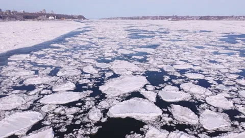 Aerial view of broken ice floating on cold river water Stock Footage 330315227