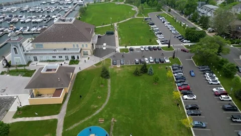 Aerial view of Bronte Harbour waterfront park and marina facilities in Oakville Stock Footage 330760211