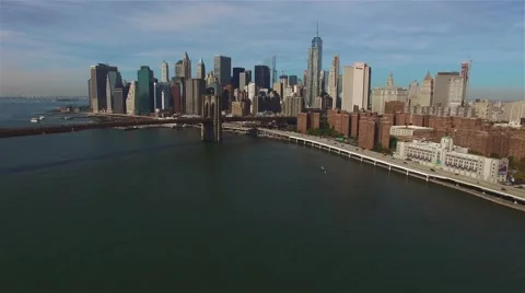 Aerial view of Brooklyn Bridge. Camera is moving closer to Manhattan. Video stock 58566835
