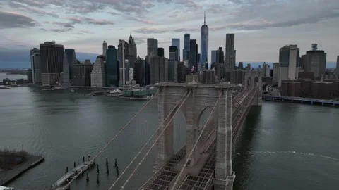 An aerial view of the Brooklyn Bridge during a cloudy sunrise. Lower Stock Footage 236612258