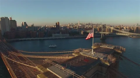 Aerial view of Brooklyn bridge at sunset. Camera moving right. Stock Footage 58568682