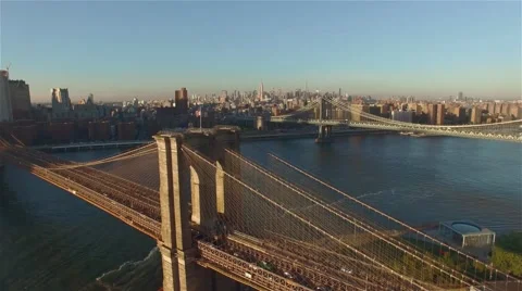 Aerial view of Brooklyn bridge at sunset. Camera freezes Upper Town. Stock Footage 58568830