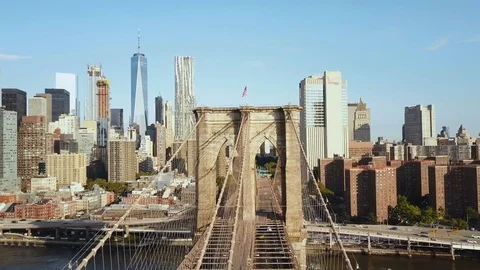 Aerial view of the Brooklyn bridge through the East river to Manhattan district Stock Footage 80118277
