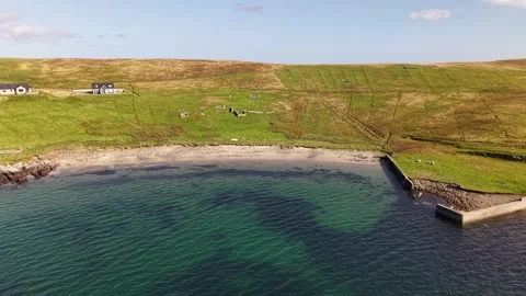 Aerial View of Broonies Taing Beach, Sandwick, Shetland Stock Footage 345473627