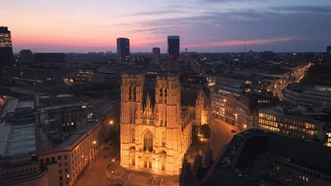Aerial View of Brussels at dusk with illuminated buildings and a clear sky Stock Footage 345163592