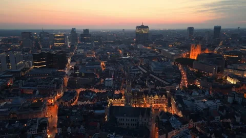 Aerial View of Brussels at dusk with illuminated buildings and a clear sky Stock Footage 345164099