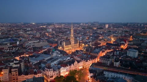 Aerial View of Brussels at dusk with illuminated buildings and a clear sky Stock Footage 345167933