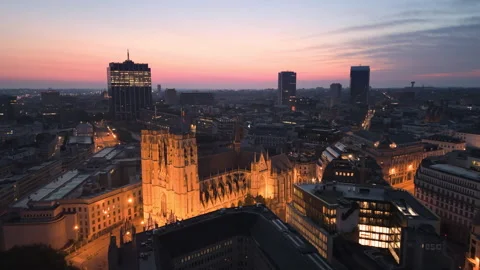Aerial View of Brussels at dusk with illuminated buildings and a clear sky Stock Footage 345168436
