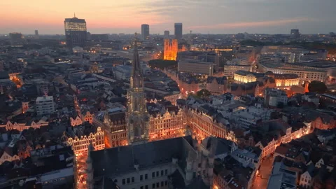 Aerial View of Brussels at dusk with illuminated buildings and a clear sky Stock Footage 345168552