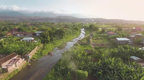 Aerial view of Bubunan town, Seririt, north Bali, mountains in background Stock Footage 68083389