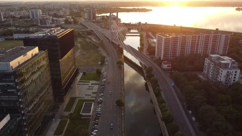 Aerial view of Bucharest office buildings and Dambovita River at sunset Stock Footage 312354736