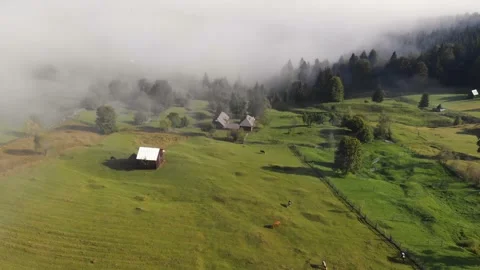 Aerial view of Bucovina summer landscape in Romania with mist, mountains and for Stock Footage 140102353