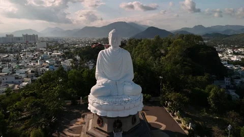 Aerial view of buddha statue over nha trang city in vietnam with mountains .. Stock Footage 335020219