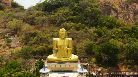 Aerial view of Buddhist temple with a Buddha statue in the Mountains. Sri Lanka Stock Footage 203753142