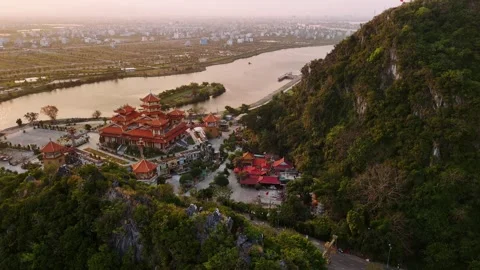 Aerial view of buddhist temple in da nang marble mountains during a sunset .. Stock Footage 335028696