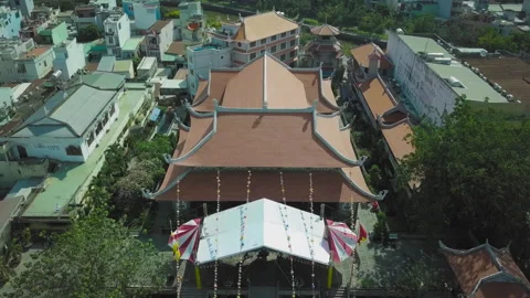 Aerial view of a buddhist temple in a vietnamese city Stock Footage 329496331