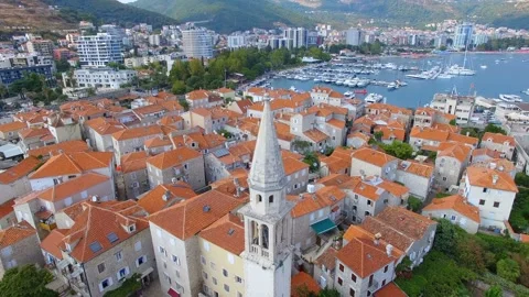 Aerial View Of Budva Old Town Tower and Pier, Montenegro 1 Stock Footage