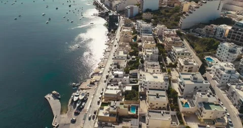 Aerial View of Bugibba in Malta Featuring Urban Seaside Landscape Stock Footage 294400666