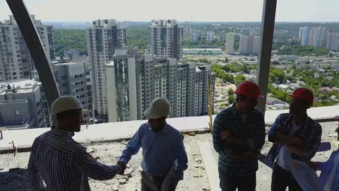 Aerial View Of Builders Team Handshake With Business Man Employer On Stock Footage