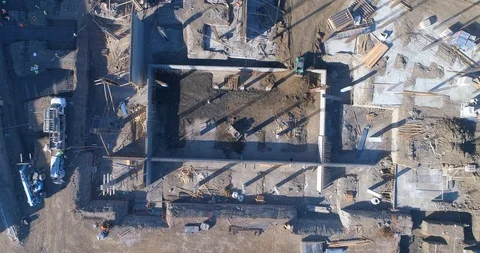 Aerial view of builders working at a construction site Stock Footage 85651567