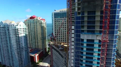 AERIAL - View of building with construction elevator Stock Footage 65153983