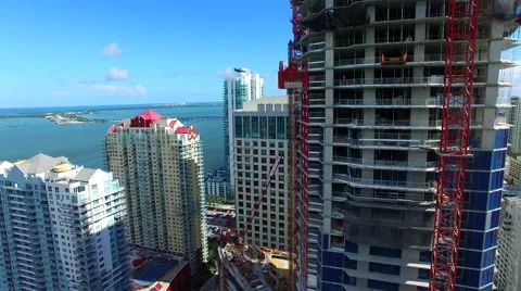AERIAL - View of a building in construction in front of the ocean. Stock Footage 65154006