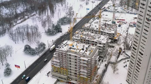 Aerial view of building construction site in winter Stock Footage 100961684