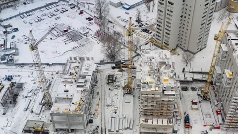 Aerial view of building construction site in winter Stock Footage 100962023