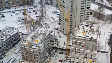 Aerial view of building construction site in winter Stock Footage 100962145