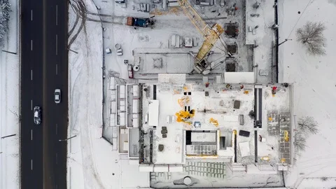 Aerial view of building construction site in winter Stock Footage 100962349