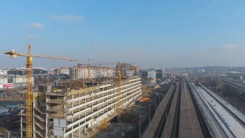 Aerial view of building construction site with crane and workers Stock Footage 126097913