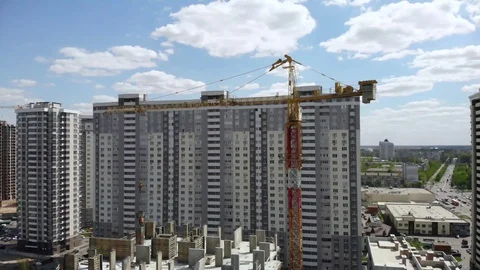 Aerial view of building construction site with crane and workers Stock Footage 129597663