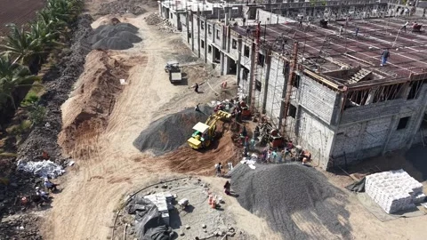 Aerial View of Building Construction Site with Workers and Machinery in Rural Stock Footage 344230189