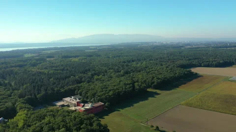 Aerial view building lost between fields and forest Video stock 156052226