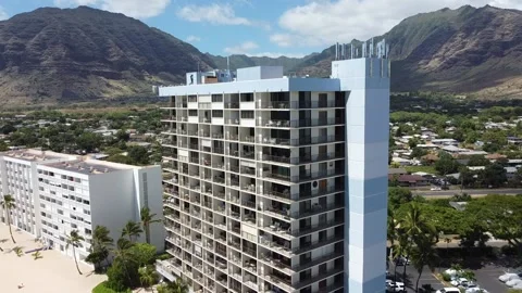 Aerial view of building with mountains in the back Stock Footage 157994756
