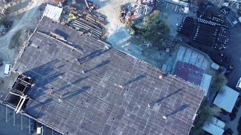 Aerial view of a building under construction in the suburbs Stock Footage 163339514
