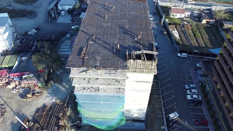 Aerial view of a building under construction in the suburbs Stock Footage 163339903