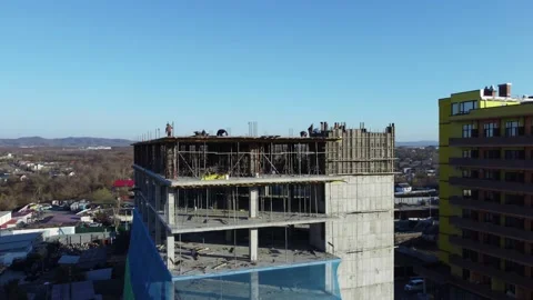 Aerial view of a building under construction in the suburbs Stock Footage 163339952
