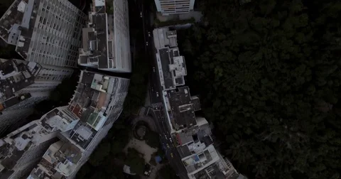 Aerial view of buildings tilting down to the Lagoon in Rio De Janeiro. Brazil. Stock Footage 77762875