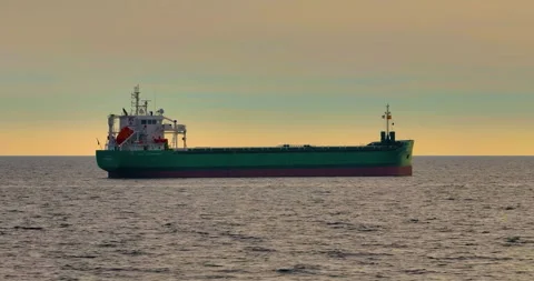 Aerial view of bulk cargo carrier sea ship anchored in sea waiting entering port Vídeo Stock 262063395