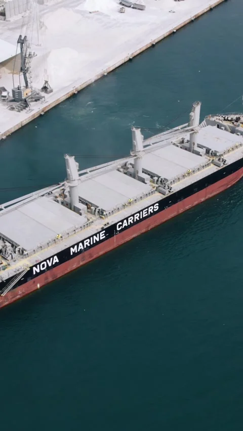 Aerial view of bulk carrier ship and tugboat in Castellon, Spain 28.07.2026 Stock Footage 345824928