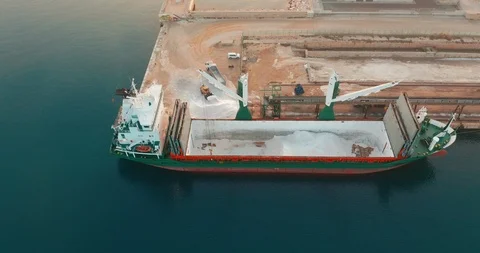 Aerial view. Bulk carrier unloading cargo in harbor. Stock Footage 126706673