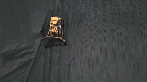 Aerial View of Bulldozer Working on a Large Coal Stockpile at Power Plant Stock-Footage 333555972